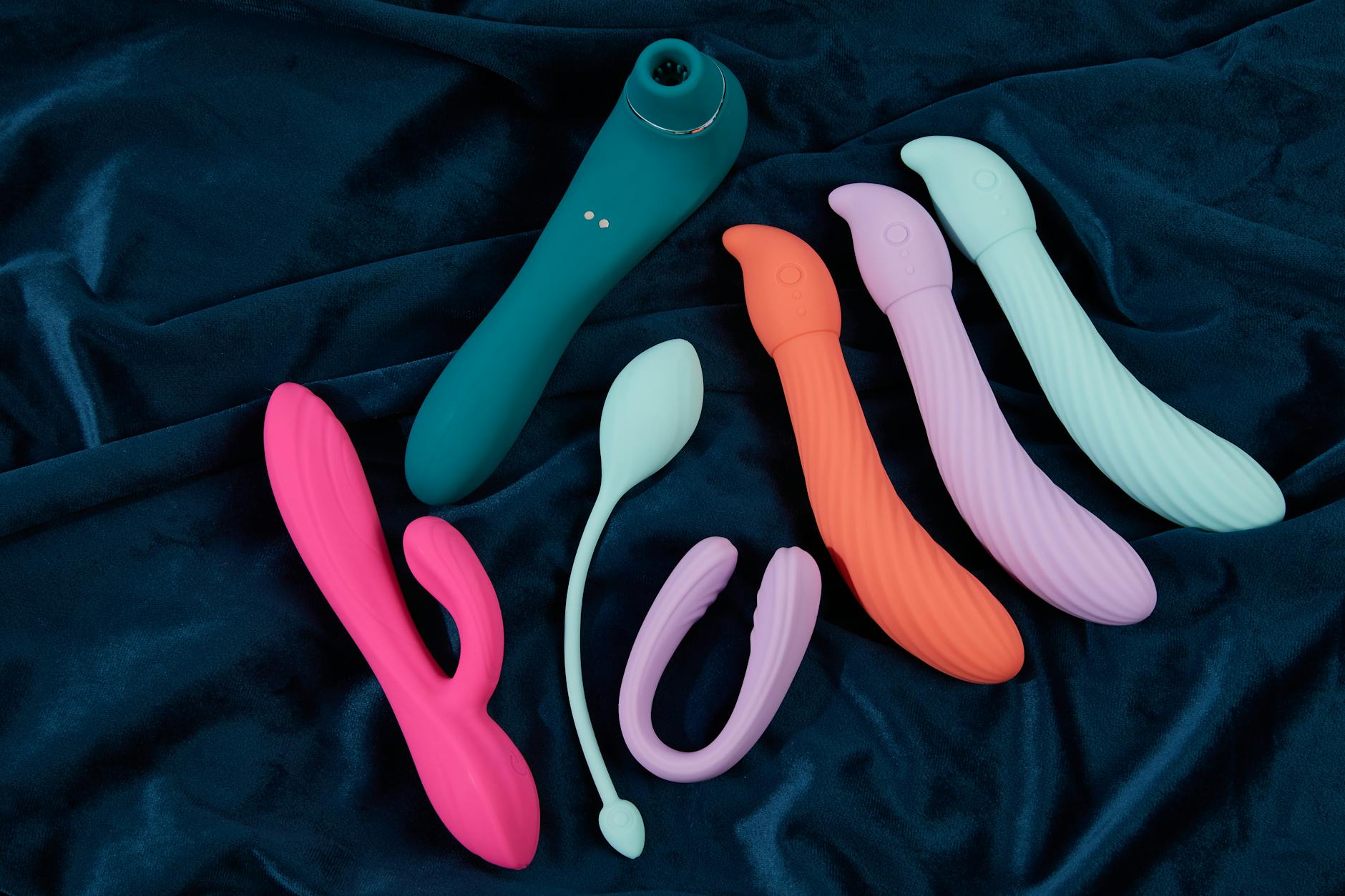 A couple together holding a vibrator, representing modern intimacy and shared pleasure