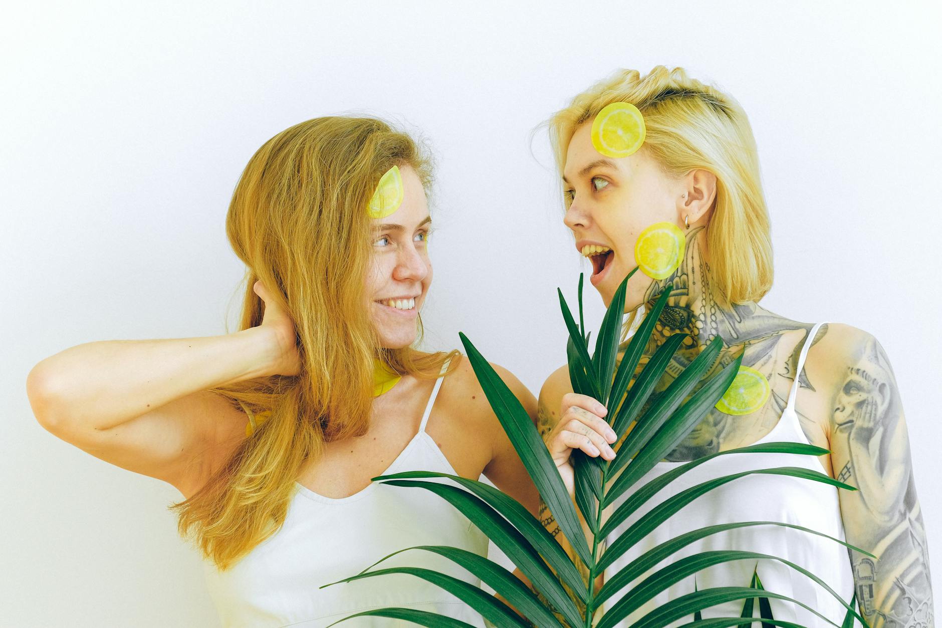 Two people smiling and enjoying fresh fruit together, representing reconnection and joy after postpartum recovery