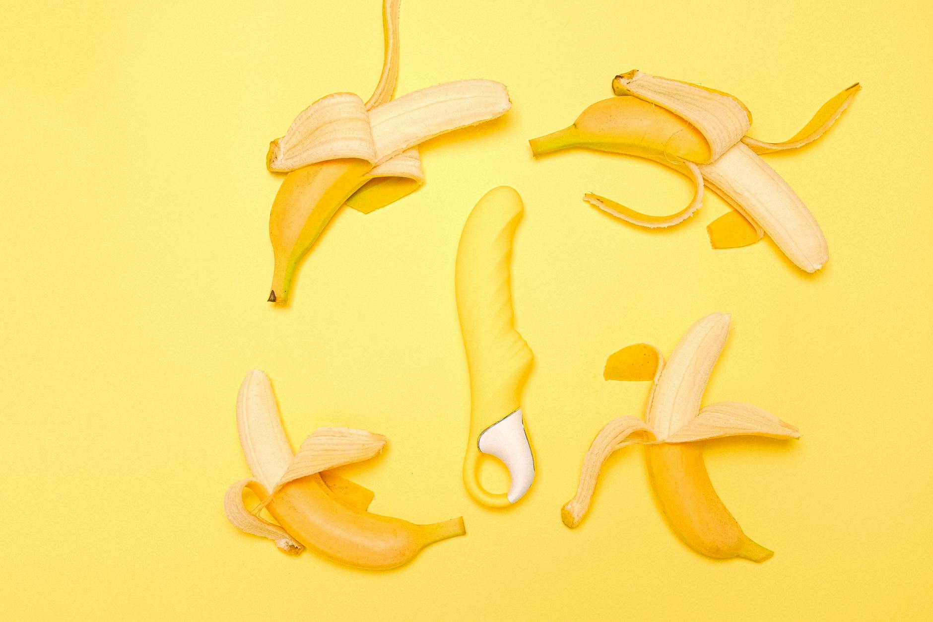 A couple standing together indoors, exploring intimacy and connection with a modern vibrator