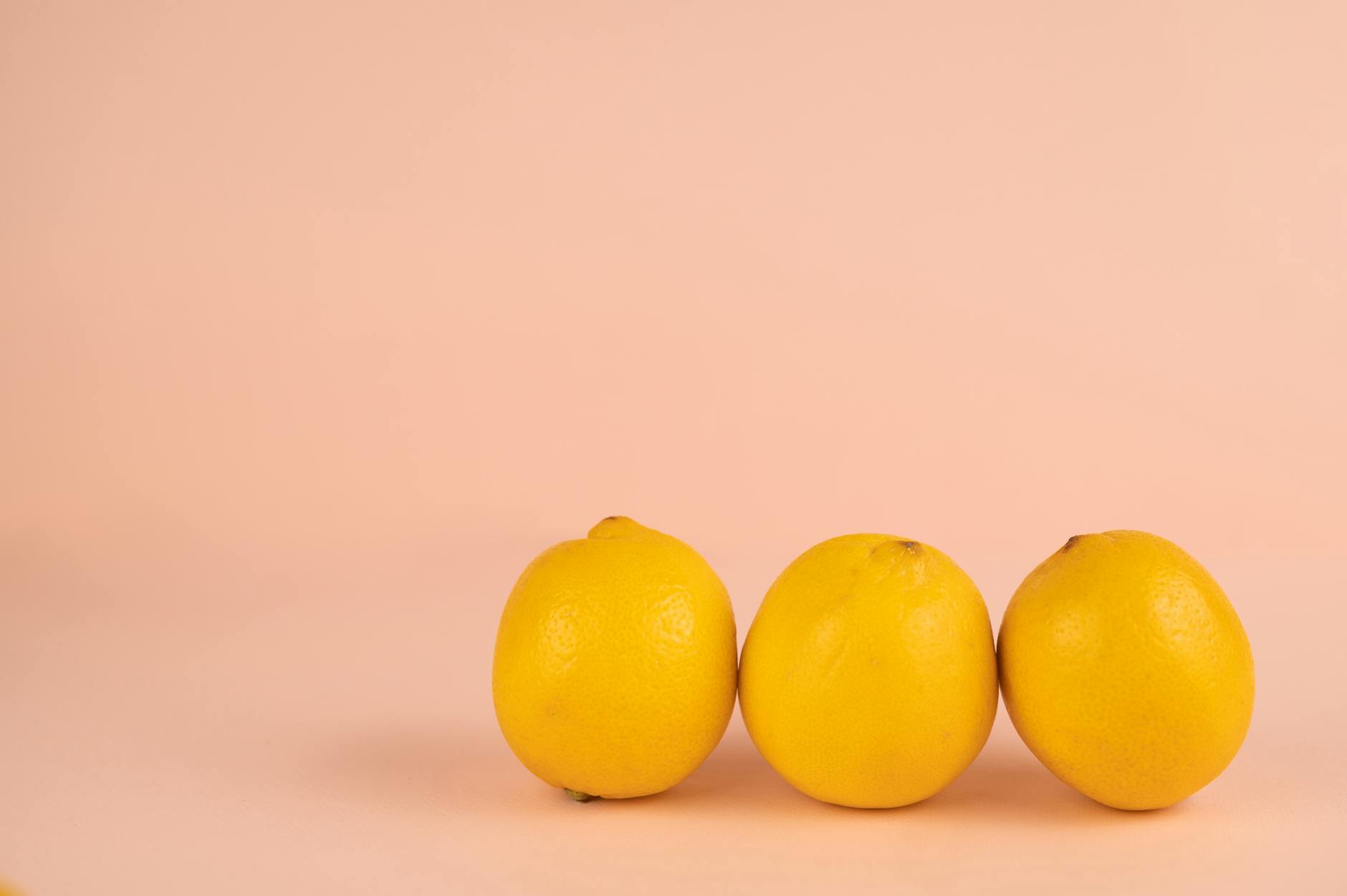 Bright ripe lemons arranged on a pastel background, representing fresh approaches to age-related intimacy